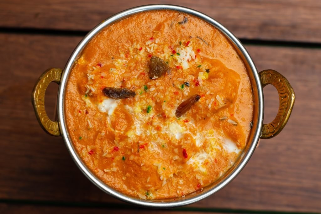Rich slow-cooked Shahi Paneer served in traditional brass handi