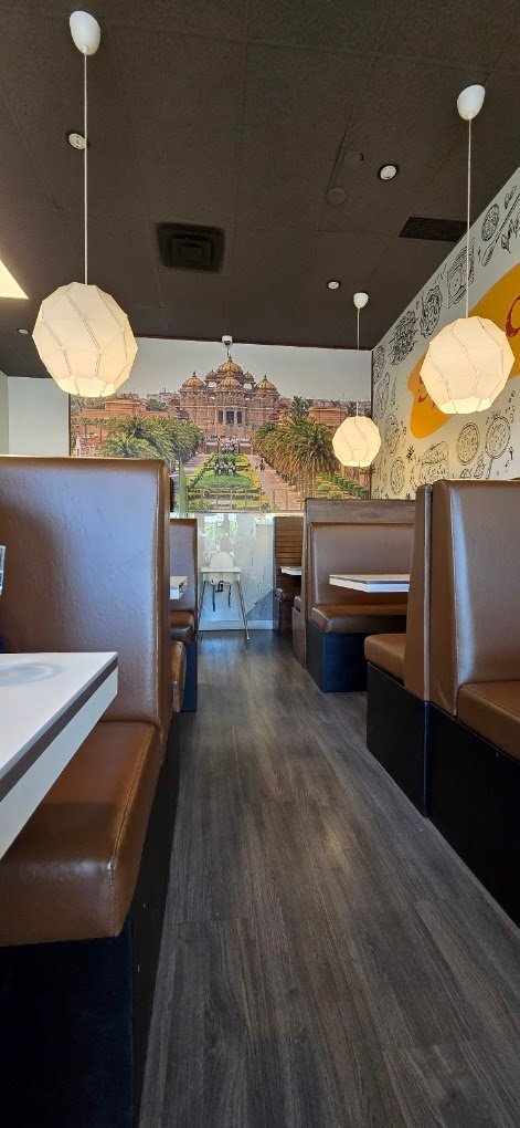 Dining aisle with modern lantern pendant lighting